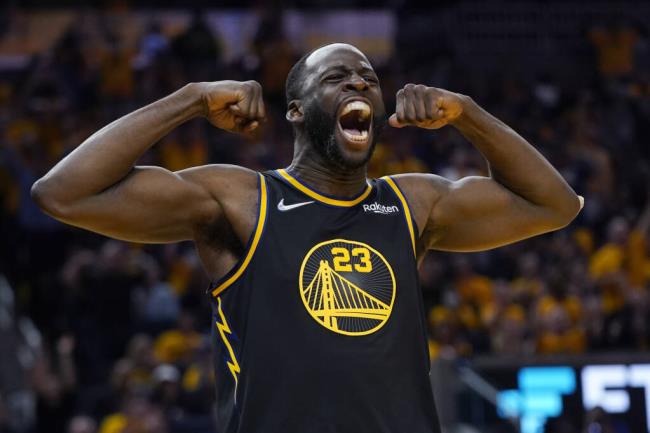 FILE - Golden State Warriors forward Draymond Green celebrates after scoring against the Dallas Mavericks during the second half in Game 5 of the NBA basketball playoffs Western Co<em></em>nference finals in San Francisco, Thursday, May 26, 2022. The Golden State Warriors want to keep Draymond Green, yet the team is prepared for him to formally decline his $27.5 million player option for the final year of his co<em></em>ntract next season and become an unrestricted free agent seeking a long-term deal.(AP Photo/Jeff Chiu, File)