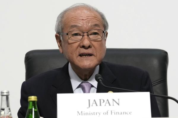 Finance Minister Shunichi Suzuki says Japan is closely mo<em></em>nitoring currency moves after the dollar hit a seven-mo<em></em>nth high on Tuesday. | AP / VIA BLOOMBERG