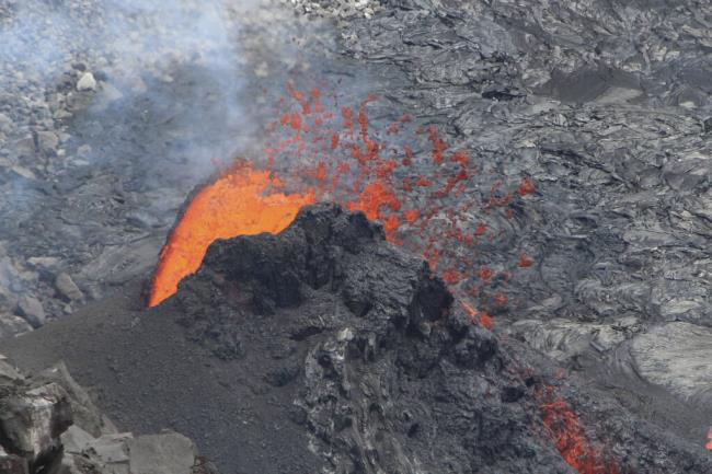 In this photo provided by the U.S. Geological Survey, is an eruption taking place on the summit of the Kilauea volcano in Hawaii, on Friday, June 16, 2023. The eruption that began nearly two weeks ago has come to a pause, scientists said. Kilauea, one of the most active volcanoes in the world, began erupting on June 7 after a three-mo<em></em>nth pause, displaying fountains of glowing red lava without threatening any communities or structures. (U.S. Geological Survey via AP)