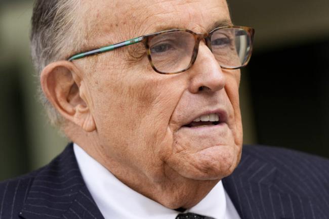 FILE - Rudy Giuliani speaks with reporters as he departs the federal courthouse, May 19, 2023, in Washington. Giuliani, who as a member of Do<em></em>nald Trump's legal team sought to overturn 2020 presidential election results in battleground states, was interviewed recently by investigators with the Justice Department special counsel's office, according to a person familiar with the matter. (AP Photo/Patrick Semansky, File)
