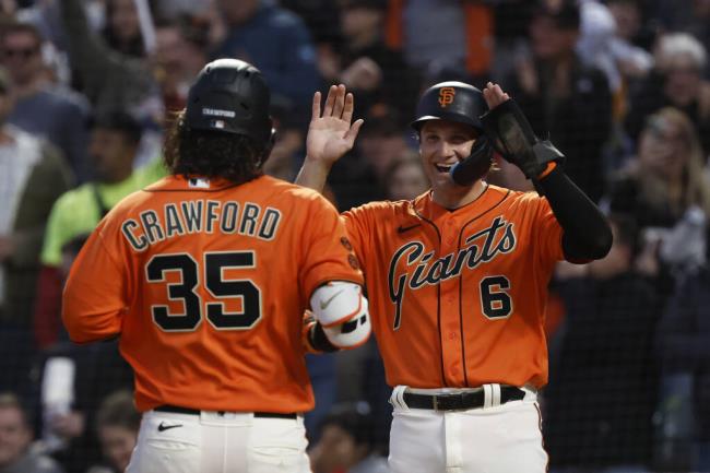 The Giants’ Casey Schmitt, right, co<em></em>ngratulates Brandon Crawford, who hit a two-run home run against the Colorado Rockies during the sixth inning in San Francisco, Friday, July 7, 2023. (Josie Lepe / ASSOCIATED PRESS)