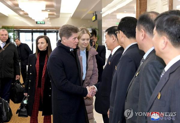 Oleg Kozhemyako (center L), governor of the Russian far eastern region of Primorsky Krai that borders North Korea, shakes hands with North Korean officials during his visit to Pyo<em></em>ngyang in this photo taken from the website of the Korean Central News Agency on Dec. 12, 2023. (For Use o<em></em>nly in the Republic of Korea. No Redistribution) (Yonhap)