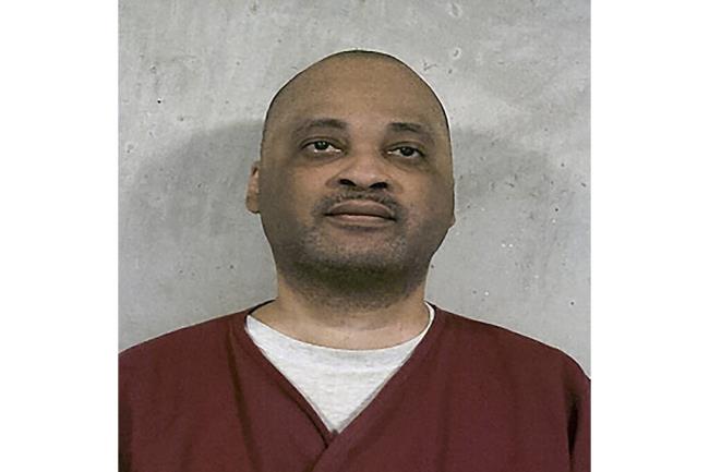 FILE - This Feb. 11, 2023, booking photo provided by the Oklahoma Department of Corrections shows death row inmate Jemaine Cannon. Oklahoma is preparing to execute Cannon on Thursday, July 20, 2023, for stabbing 20-year-old Sharo<em></em>nda Clark to death with a butcher knife in 1995 after his escape from a prison work center. In a statement sent to The Associated Press this week, Cannon's attorney, Mark Henricksen, said the state's decision to proceed with Cannon's execution amounts to “historic barbarism.” But prosecutors from the attorney general's office and Clark's adult daughters have urged the state to execute Cannon. (Oklahoma Department of Corrections via AP, File)