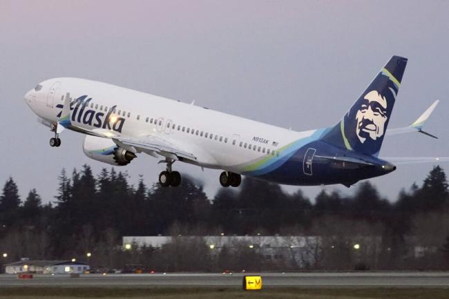 FILE - The first Alaska Airlines passenger flight on a Boeing 737-9 Max airplane takes off, Monday, March 1, 2021, on a flight to San Diego from Seattle-Tacoma Internatio<em></em>nal Airport in Seattle. (AP Photo/Ted S. Warren, File)