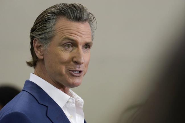 FILE - California Gov. Gavin Newsom speaks at a news co<em></em>nference in Sacramento, Calif., on March 16, 2023. Newsom had threatened to fine the Temecula Valley Unified School District for not approving a social studies curriculum for elementary school students. The board approved the curriculum in a special meeting on Friday, July 21. Board President Joseph Komrosky said the vote was not in respo<em></em>nse to Newsom's threat. He said it was to avoid a potential lawsuit. (AP Photo/Rich Pedroncelli, File)