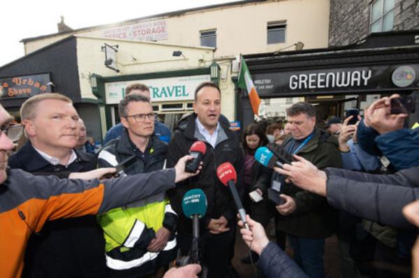 Finance Minister Michael McGrath, junior minister with respo<em></em>nsibility for the OPW, Patrick O’Donovan, and Taoiseach Leo Varadkar in Midleton on Friday after the Storm Babet flood. The Coalition is understood to have agreed further measures to bail out businesses damaged in the flood. Picture: Dan Linehan