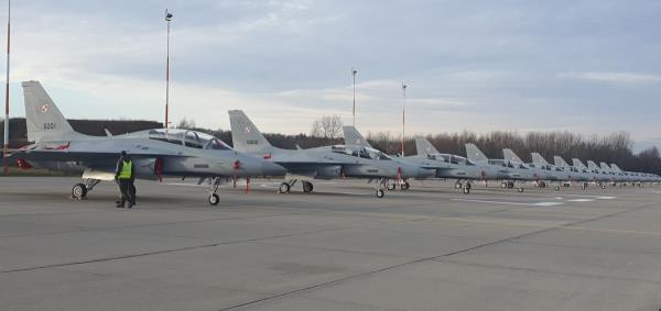 A fleet of FA-50 light combat aircraft is lined up at a Polish air ba<em></em>se in Minsk Mazowiecki, in this photo provided by Korea Aerospace industries, South Korea's fighter jet maker, on Jan. 2, 2024. (PHOTO NOT FOR SALE) (Yonhap)