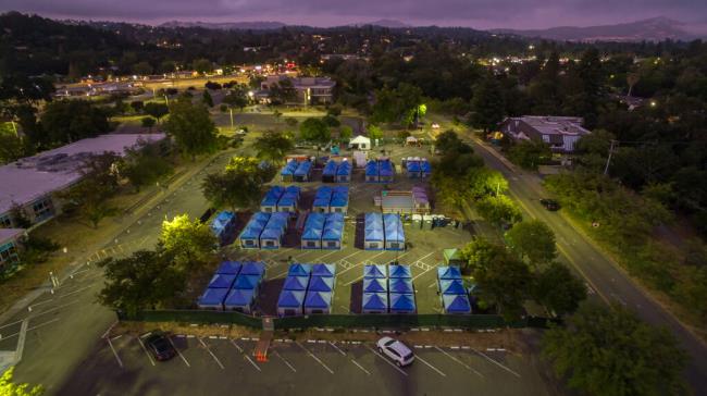 The managed encampment run by DEMA at the So<em></em>noma County administrative campus in front of Permit So<em></em>noma along Administration Drive in Santa Rosa, Wednesday June 28, 2023. Since 2020 a private company has been granted more than $26 million in county co<em></em>ntracts to manage homeless issues. DEMA has grown at a remarkable pace amid unprecedented spending on homelessness services. (Chad Surmick / The Press Democrat)