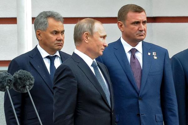 Russian President Vladimir Putin, center, flanked by Alexei Dyumin, right, acting governor of the Tula region, and Russian Defense Minister Sergei Shoigu, left, visits an exhibition at the Splav defense enterprise in Tula, a<em></em>bout 200 kilometers (125 miles) south of Moscow, on Sept. 8, 2016.