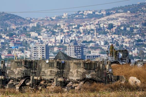 Israeli soldiers are seen in a staging area just outside the West Bank city of Jenin as seen from Israel, during an Israeli military raid on the militant stro<em></em>nghold of the Jenin refugee camp in the occupied West Bank, on July 4, 2023.