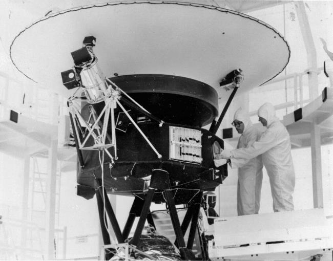 FILE - In this Aug. 4, 1977, photo provided by NASA, the "Sounds of Earth" record is mounted on the Voyager 2 spacecraft in the Safe-1 Building at the Kennedy Space Center, Fla., prior to encapsulation in the protective shroud. NASA is listening for any peep from Voyager 2 after losing co<em></em>ntact with the spacecraft billions of miles away. (AP Photo/NASA, File)