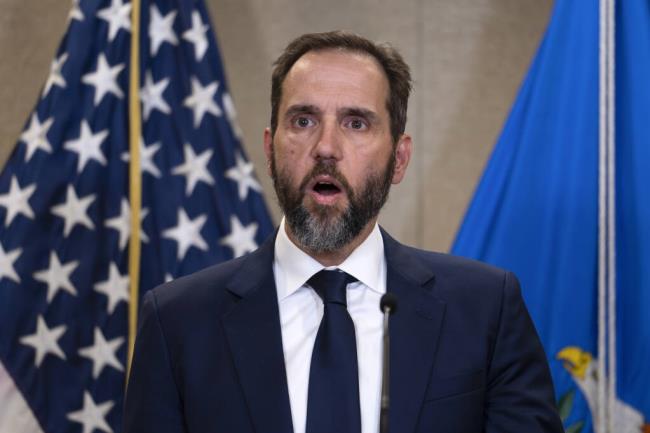 FILE - Special counsel Jack Smith speaks to the media a<em></em>bout an indictment of former President Do<em></em>nald Trump, Aug. 1, 2023, at an office of the Department of Justice in Washington. As Do<em></em>nald Trump faces the prospect of being held accountable for his efforts to overturn the 2020 election, threats to democracy in the United States persist heading into the next campaign. (AP Photo/J. Scott Applewhite, File)