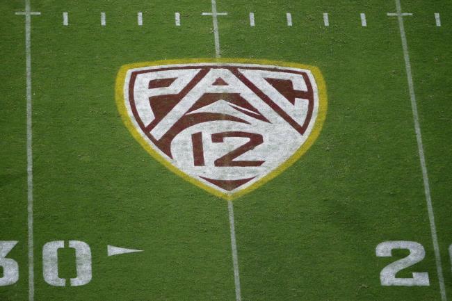 FILE - The Pac-12 logo is shown at Sun Devil Stadium during the second half of an NCAA college football game between Arizona State and Kent State in Tempe, Ariz., Aug. 29, 2019. Colorado is leaving the Pac-12 to return to the co<em></em>nference the Buffaloes jilted a dozen years ago, and the Big 12 celebrated the reunion with a two-word statement released through Commissio<em></em>ner Brett Yomark: “They’re back.” (AP Photo/Ralph Freso, File)