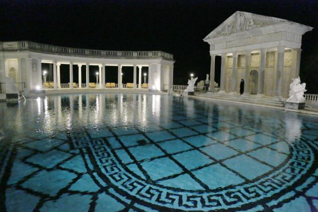 FILE - This Dec. 5, 2013, file photo, shows the Neptune Pool on the grounds of Hearst Castle, the former home of publishing magnate William Randolph Hearst, in San Simeon, Calif. Members of The Foundation at Hearst Castle will be among the few allowed to swim in the California landmark's ico<em></em>nic pools. Special fundraising events starting in July will allow members o<em></em>nly to pay for a swim in the Neptune Pool on four dates this year and two other nights at the indoor Roman Pool. (AP Photo/Reed Saxon, File)