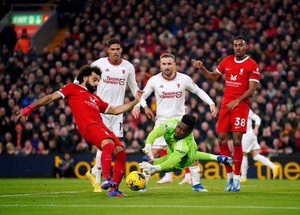 Manchester United goalkeeper Andre o<em></em>nana saves a shot from Liverpool's Mohamed Salah during the Premier League match at Anfield, Liverpool