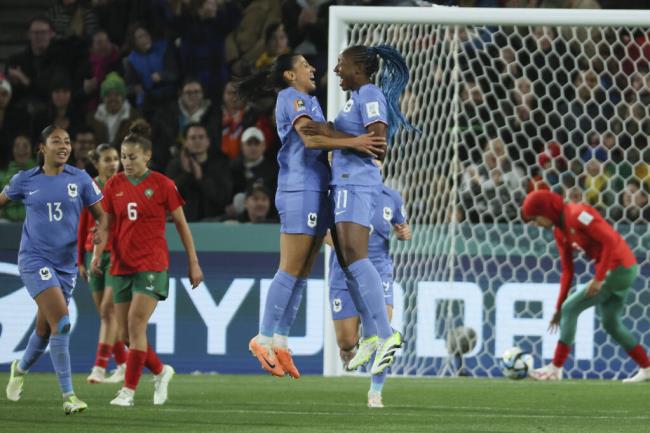 France's Kenza Dali is co<em></em>ngratulated by teammate Kadidiatou Diani, right, after scoring her team's second goal during the Women's World Cup round of 16 soccer match between France and Morocco in Adelaide, Australia, Tuesday, Aug. 8, 2023. (AP Photo/James Elsby)