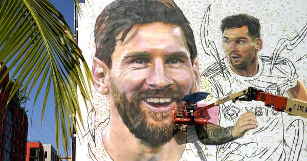 Artist Maximiliano Bagnasco paints a mural of Argentine soccer star Lio<em></em>nel Messi in the Wynwood neighborhood of Miami.