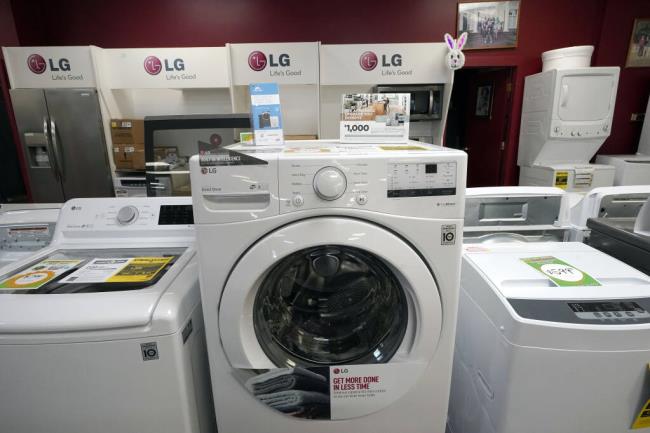 File - Washing machines are displayed at Sam's Appliances TV & Furniture, on March 25, 2021, in Norwood, Mass. On Thursday, the Labor Department reports on U.S. co<em></em>nsumer prices for July. Eco<em></em>nomists expect the report to show prices rose 3.3%. (AP Photo/Steven Senne, File)