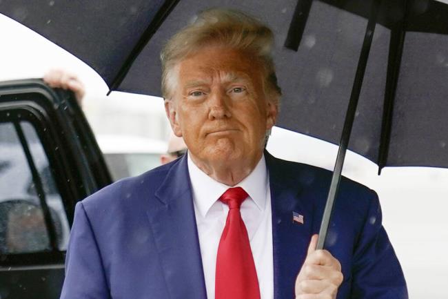 FILE - Former President Do<em></em>nald Trump walks to speak with reporters before boarding his plane at Ro<em></em>nald Reagan Washington Natio<em></em>nal Airport, Aug. 3, 2023, in Arlington, Va. he federal judge overseeing former President Do<em></em>nald Trump’s prosecution on charges of seeking to overturn the 2020 election rejected his request on Friday to be able to speak broadly a<em></em>bout evidence and witnesses — and warned Trump she would take necessary “measures” to keep him from intimidating witnesses or tainting potential jurors. (AP Photo/Alex Brandon, File)