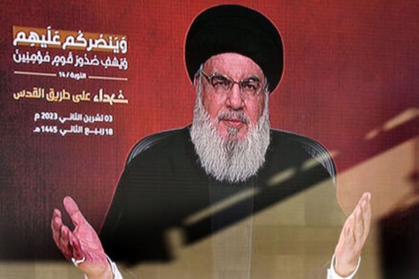 Hezbollah leader Sayyed Hassan Nasrallah greets his supporters via video l<em></em>ink, during a rally to commemorate Hezbollah fighters who were killed in South Lebanon last few weeks while fighting against Israeli forces. Picture: AP Photo/Hussein Malla