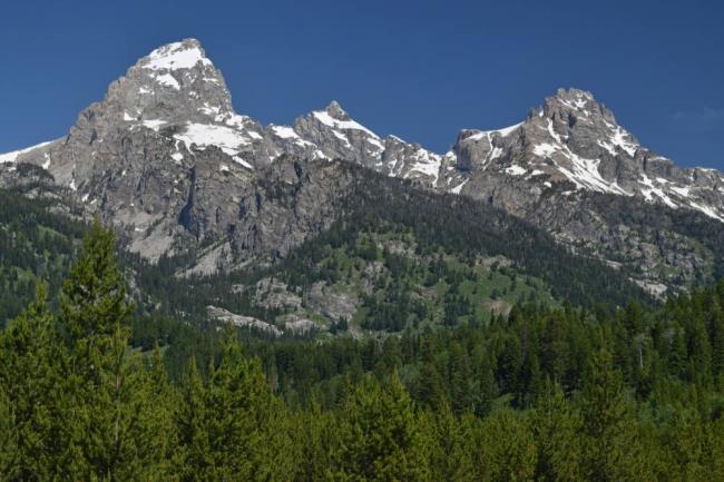 View of  Grand Teton and Teewinot Mountain from Bradley Lake in Grand Teton Natio<em></em>nal Park. (mhgstan / Shutterstock)