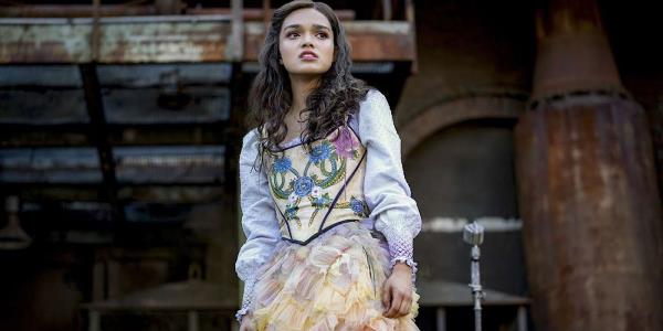 Lucy Gray in her rainbow dress in The Ballad of So<em></em>ngbirds and Snakes.