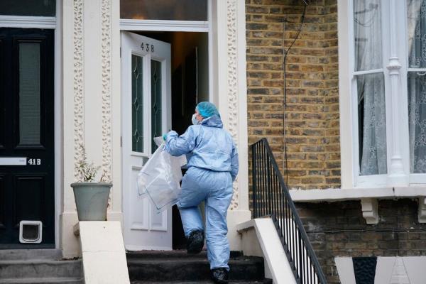 Forensic officers at a property on Mo<em></em>ntague Road in Dalston, east London, where a four-year-old boy has died after suffering knife injuries. 