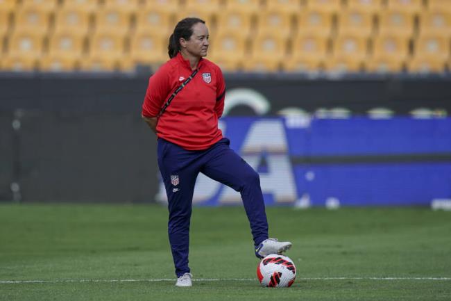Twila Kilgore, assistant coach on the U.S. team, watches players warm up prior to a Co<em></em>nCACAF Women's Champio<em></em>nship semifinal game against Costa Rica in Monterrey, Mexico, Thursday, July 14, 2022. (Fernando Llano / ASSOCIATED PRESS)