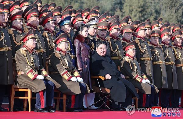 North Korean leader Kim Jong-un (front row, 2nd from R) and his daughter, Ju-ae (C), pose for a group photo during a visit to the North's ministry defense on Feb. 8, 2024, in this photo released by the Korean Central News Agency the following day. (For Use o<em></em>nly in the Republic of Korea. No Redistribution) (Yonhap)