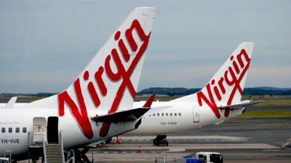 TWU-aligned cabin crew members at Virgin Australia are set to decide on strike action over what they say are poor pay and work co<em></em>nditions at the airline. NCA NewsWire / Nicholas Eagar