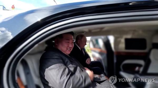 This file image, captured from footage of North Korea's state-run Korean Central Television on Sept. 20, 2023, shows the North's leader Kim Jong-un (L) and Russian President Vladimir Putin taking a seat in Putin's presidential Aurus Senat limousine at Vostochny Cosmodrome in the Russian Far East on Sept. 13. (For Use o<em></em>nly in the Republic of Korea. No Redistribution) (Yonhap)
