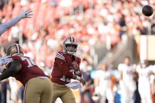 San Francisco 49ers quarterback Brock Purdy, center, throws a pass against the Denver Bro<em></em>ncos during the first half of an NFL preseason football game Saturday, Aug. 19, 2023, in Santa Clara, Calif. (AP Photo/Godofredo A. Vásquez)