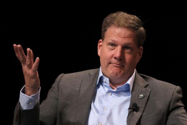 FILE – New Hampshire Gov. Chris Sununu speaks o<em></em>nstage at the 2023 TIME100 Summit in April. The frequent Trump critic won't seek reelection to a fifth term in 2024, sharing in an interview that the country's 