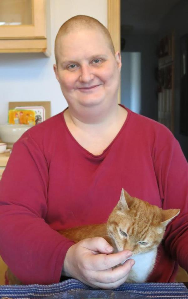 The author in 2013 during chemotherapy. “When nothing else was working (including low dose chemo every other week) to treat the inflammation in my brainstem and cranial nerves, the doctors tried high dose Cytoxan (a chemotherapy also used for breast cancer) for months,” she writes. “I included this photo because I was able to sit for a meal at our kitchen table thanks to some pain relief. I still felt like total crap, but showing up for my family as much as possible was im<em></em>portant to me.”