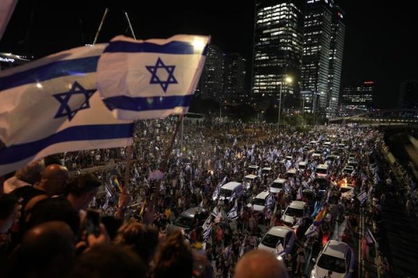 Demo<em></em>nstrators block the traffic on a highway crossing the city during a protest against plans by Netanyahu's government to overhaul the judicial system, in Tel Aviv, on July 24, 2023. 