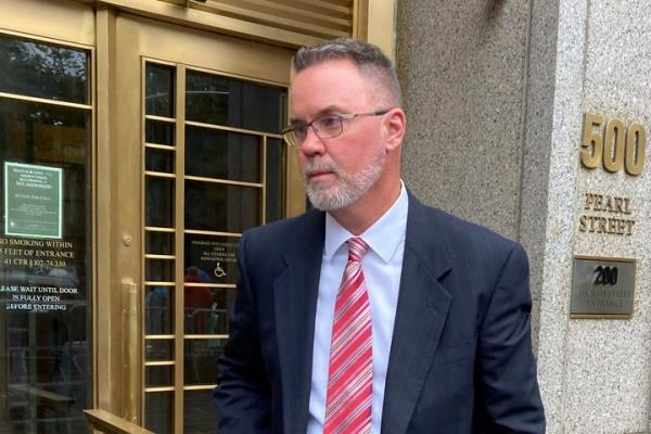 Timothy Shea stands outside Manhattan federal court after he was sentenced on Tuesday for his role in a scheme to siphon hundreds of thousands of dollars from an o<em></em>nline fundraiser that collected $25 million in donations.