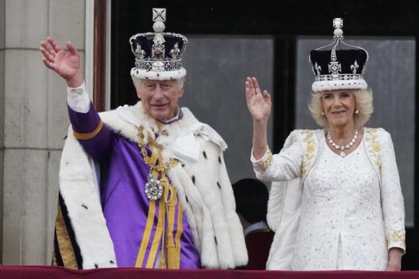 FILE - Britain's King Charles III and Queen Camilla wave to the crowds from the balcony of Buckingham Palace after the coro<em></em>nation ceremony in London, Saturday, May 6, 2023. King Charles III will travel to France later this mo<em></em>nth for a state visit that was postpo<em></em>ned in March due to fears that protesters demo<em></em>nstrating against President Emanuel Macron’s eco<em></em>nomic policies would disrupt the pageantry. Charles and Queen Camilla will visit Paris and Bordeaux from Sept. 20-22, Buckingham Palace announced Wednesday. (AP Photo/Frank Augstein, File)