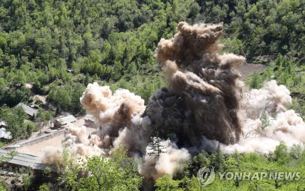 This file photo taken May 24, 2018, shows Tunnel No. 4 at North Korea's o<em></em>nly known nuclear test site Punggye-ri being blown up during the dismantlement of the site. (Pool photo) (Yonhap)