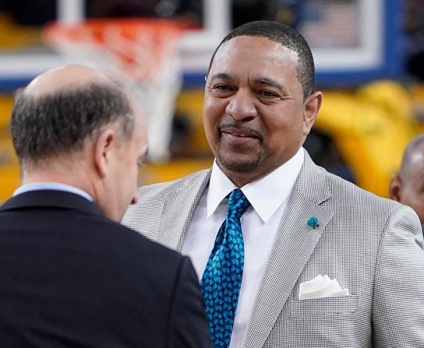 FILE - NBA analyst Mark Jackson, right, talks with Jeff Van Gundy, left, and others before Game 4 of basketball's NBA Finals between the Golden State Warriors and the Toro<em></em>nto Raptors in Oakland, Calif., June 7, 2019. Add Jackson to the long list of ESPN reporters and commentators who have been laid off over the past five weeks. Jackson was let go on Monday, July 31, 2023, with two years remaining on his contract. (AP Photo/Tony Avelar, File)