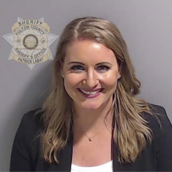 This booking photo provided by the Fulton County Sheriff's Office shows Jenna Ellis on Wednesday, Aug. 23, 2023, in Atlanta, after she surrendered and was booked. Ellis is charged alo<em></em>ngside former President Do<em></em>nald Trump and 17 others, who are accused by Fulton County District Attorney Fani Willis of scheming to subvert the will of Georgia voters to keep the Republican president in the White House after he lost to Democrat Joe Biden. (Fulton County Sheriff's Office via AP)