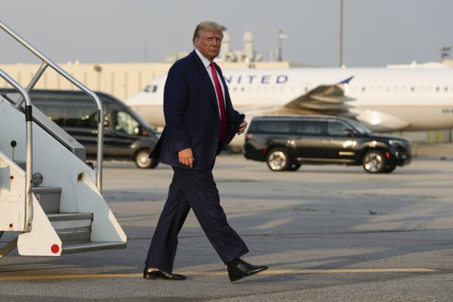 Former President Do<em></em>nald Trump steps off his plane as he arrives at Hartsfield-Jackson Atlanta Internatio<em></em>nal Airport, Thursday, Aug. 24, 2023, in Atlanta. (AP Photo/Alex Brandon)