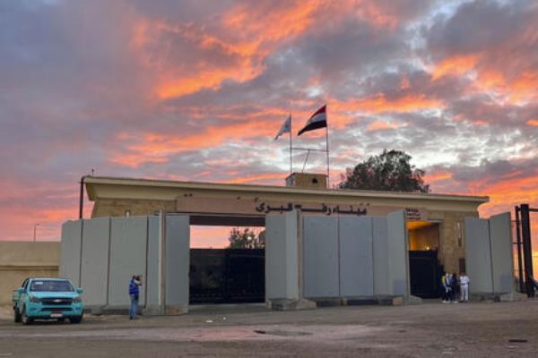 Policemen stand at Rafah crossing port, Egypt, as humanitarian aid co<em></em>nvoy for the Gaza Strip is parked Tuesday, Oct. 17, 2023. Picture: AP Photo/Omar Aziz