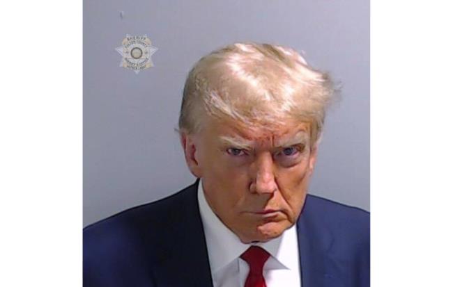This booking photo provided by the Fulton County Sheriff’s Office shows former President Do<em></em>nald Trump on Thursday, Aug. 24, 2023, after he surrendered and was booked at the Fulton County Jail in Atlanta. Trump is accused by Fulton County District Attorney Fani Willis of attempting to subvert the will of Georgia voters in a bid to keep Joe Biden out of the White House. (Fulton County Sheriff’s Office via AP)