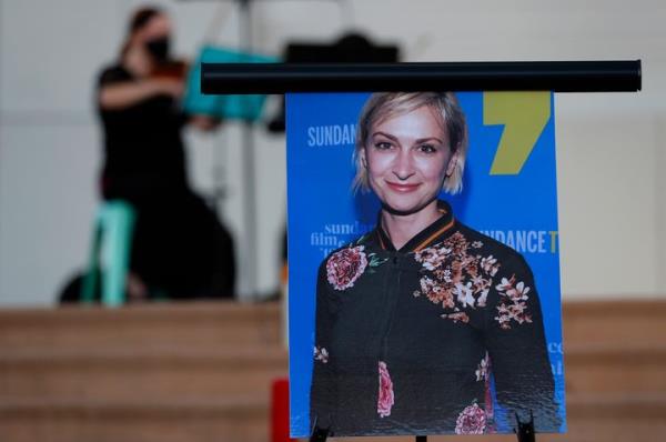 A photograph of cinematographer Halyna Hutchins is seen during a vigil in her ho<em></em>nor in Albuquerque, N.M., shortly after she was killed.