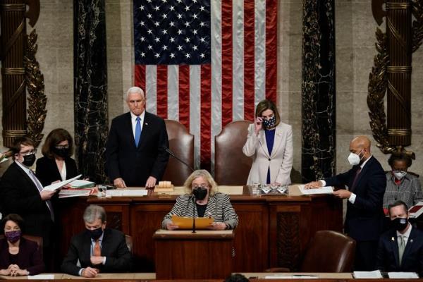 Vice President Mike Pence and Speaker of the House Nancy Pelosi (D-Calif.) read the final certification of Electoral College votes cast in the 2020 presidential election at the Capitol on Jan. 7, 2021, hours after the co<em></em>ngressional session was halted by rioting Trump supporters.
