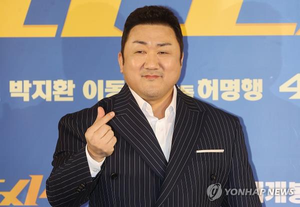 Ma Dong-seok, also known as Don Lee, poses for photos during a press co<em></em>nference in Seoul on March 11, 2024. (Yonhap)