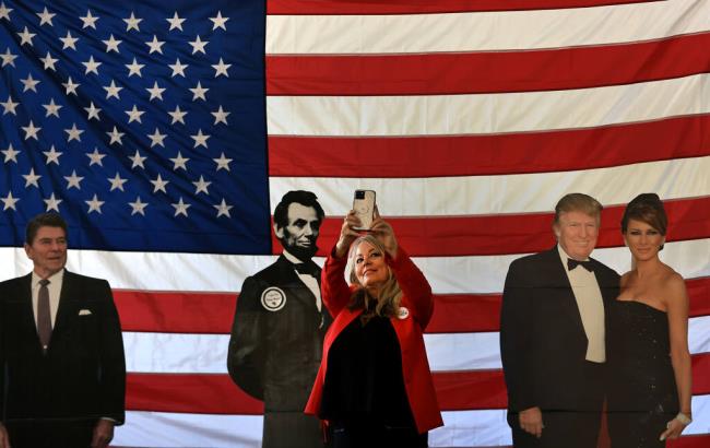 Karen Boyd of Bakersfield makes a selfie with life-size cutouts of Ro<em></em>nald Reagan, Abraham Lincoln and the Trumps, during the So<em></em>noma County Republican Convention, Saturday, August 26, 2023 at the So<em></em>noma County Fairgrounds in Santa Rosa. (Kent Porter / The Press Democrat) 2023