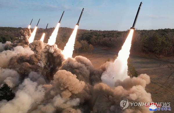 This photo, carried by North Korea's official Korean Central News Agency on March 19, 2024, shows the North's firing drills involving super-large multiple rocket launchers the previous day. (For Use o<em></em>nly in the Republic of Korea. No Redistribution) (Yonhap)