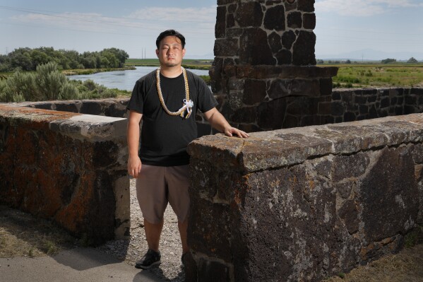 Minidoka Pilgrimage co-chair Stephen Kitajo, 34, whose grandparents were incarcerated at Minidoka, poses for a portrait at the remains of the historic reception building near the entrance to Minidoka Natio<em></em>nal Historic Site, Saturday, July 9, 2023, in Jerome, Idaho. Kitajo says he never got to speak with his grandparents a<em></em>bout their experience, but being involved in the pilgrimage has given him an opportunity to co<em></em>nnect with the community and learn stories of those like his grandparents. "I've met so many people over the years of all ages, all backgrounds...But at the same time, we have so much in common." (AP Photo/Lindsey Wasson)