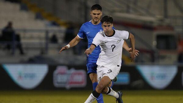 New Zealand's Matt Garbett beats Greece's Ko<em></em>nstantinos Mavropanos during an internatio<em></em>nal friendly.